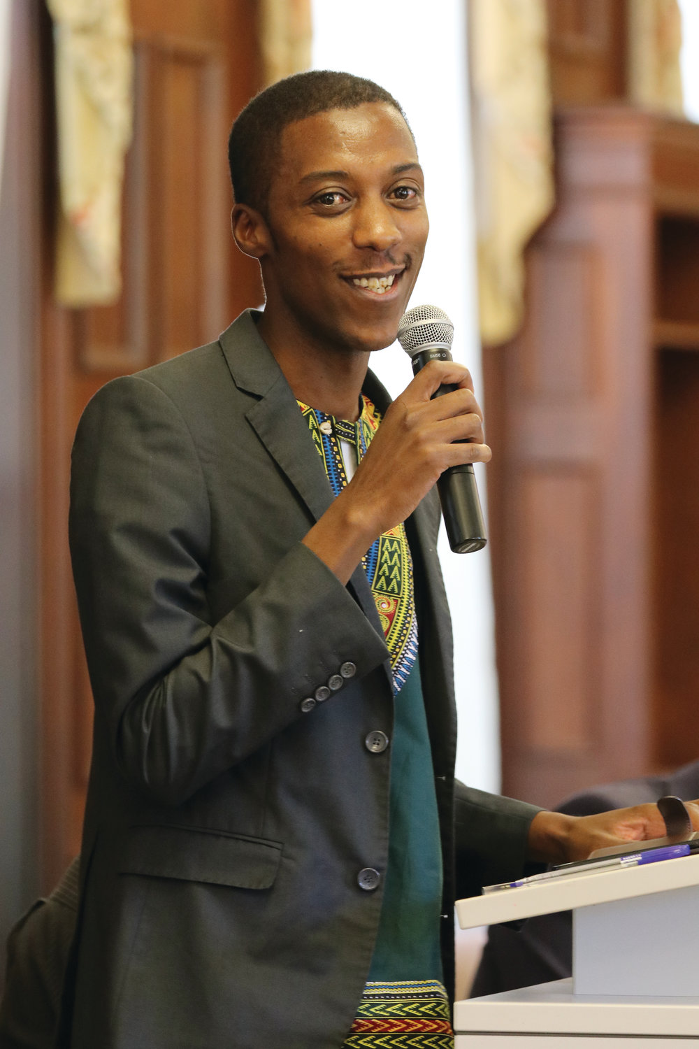 Allen Ottaro, of Nairobi, Kenya, founder and executive director of Catholic Youth Network for Environmental Sustainability in Africa, speaks at the first forum in the diocese’s Caring for Creation series, which was held  Saturday at Providence College.